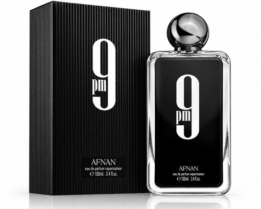 A 100ml bottle of Afnan 9pm Eau de Parfum next to its black ribbed packaging box, both featuring a prominent white '9 pm' logo on a black background.